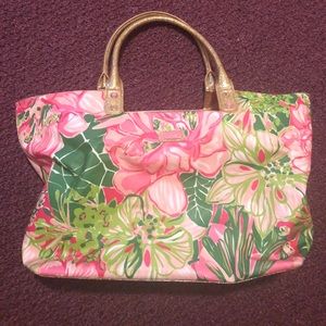 Lilly Pulitzer beach bag with gold trim.